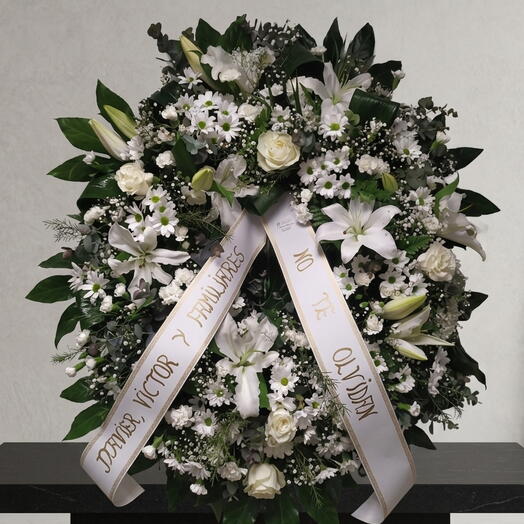 Funeral wreath with roses and white lilies