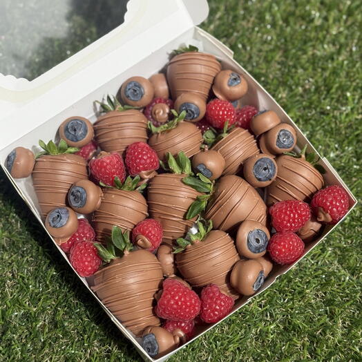 Milk Chocolate covered fresh strawberries, raspberries, blueberries