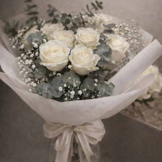 Elegant bouquet of white roses with eucalyptus and baby's breath