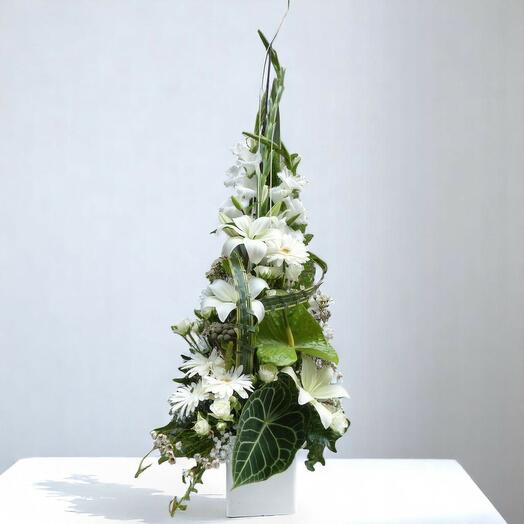 Assorted white cut flower centerpieces. Pure Emotion