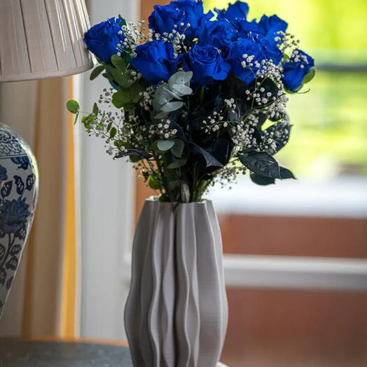 Bouquet of 6 blue roses mixed with greenery