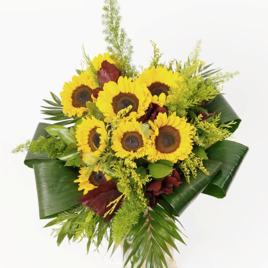 Bouquets of sunflowers with greenery and Quercus oak