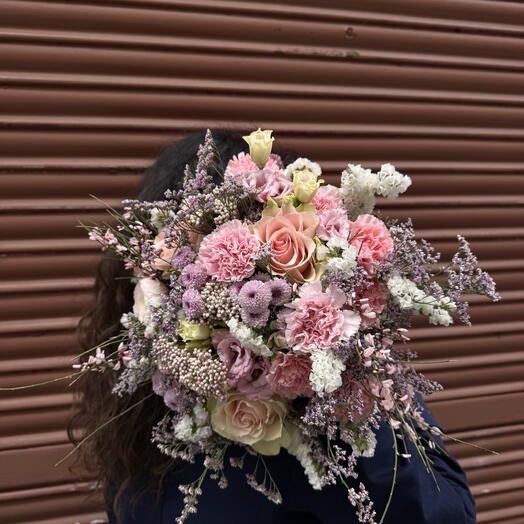 Bouquet of carnations, roses and chrysanthemums in shades of pink