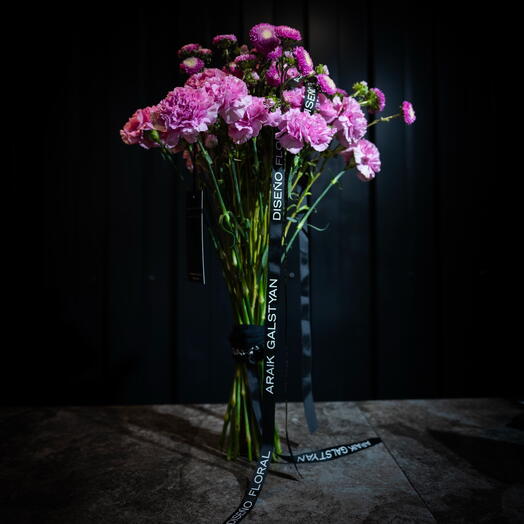 Bouquet of carnations and asters in pink tones