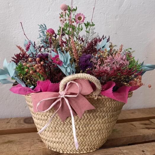 Small pink basket with dried flower