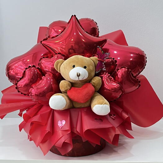 Composition de ballons en mylar et d'un ourson en peluche