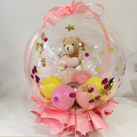 ourson en peluche dans un ballon