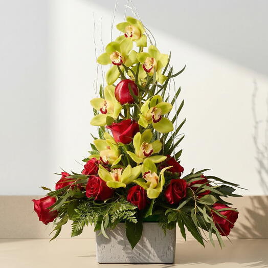 Elegance Centerpiece with Orchids – Funeral centerpiece with orchids and red roses