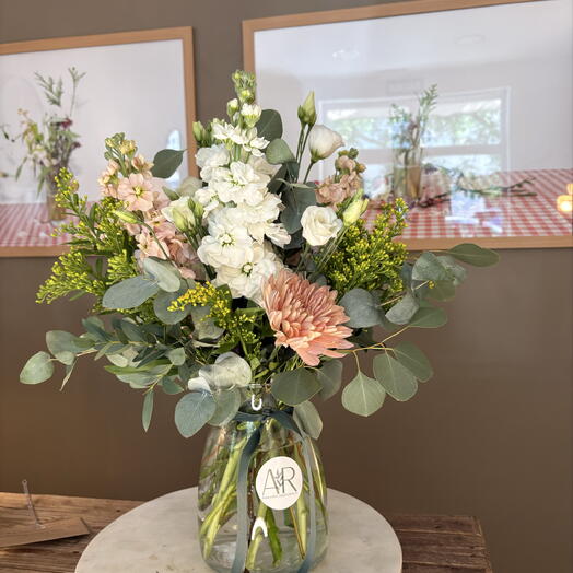 Seasonal flowers in a glass vase