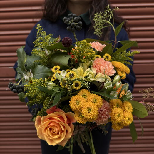 Spring bouquet of roses and chrysanthemums in yellow tones
