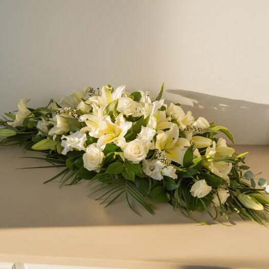 WHITE CUSHION | Sympathy floral centerpiece with white roses and lilies