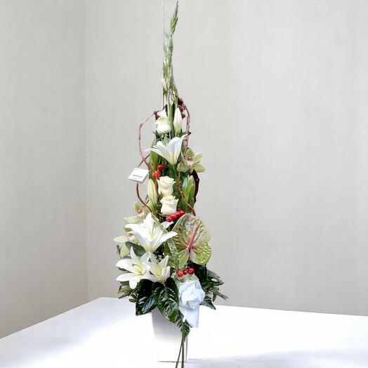 White centerpieces of assorted flowers